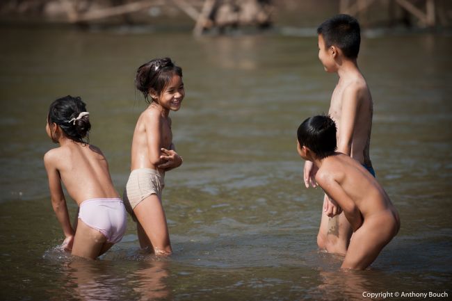 Kids Playing in the Khan River in Luang Prabang
