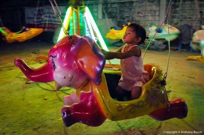 Driving the Elephant at a Funfair in Bangkok